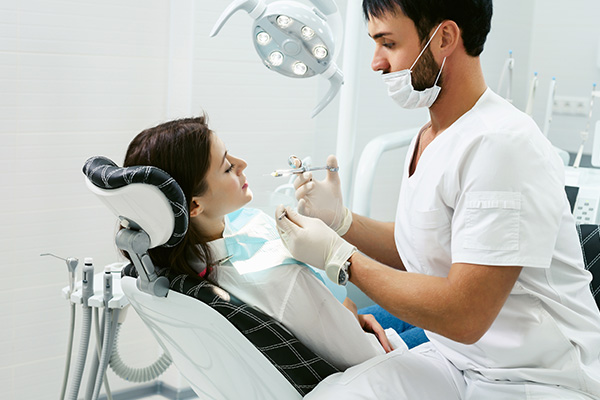 Restorative Full Mouth Reconstruction Procedures To Repair Broken Teeth